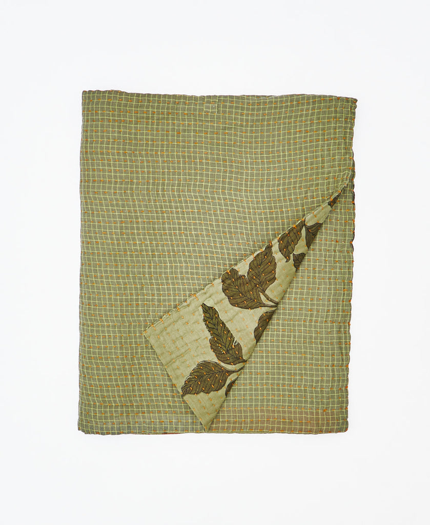 Green kantha quilt throw made using grid print 
recycled vintage saris
