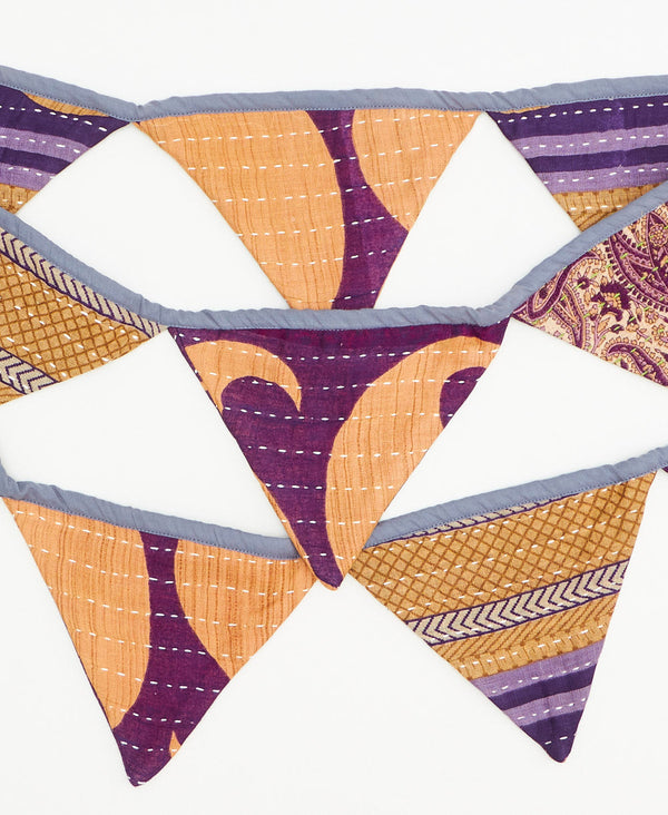handmade purple striped triangle fabric garland 
