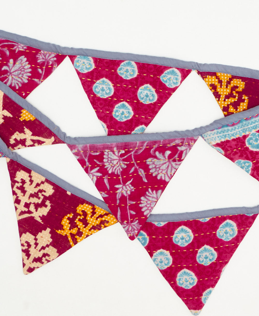 handmade magenta geometric triangle fabric garland 
