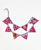 upcycled fabric garland with bold magenta geometric pattern by Anchal
