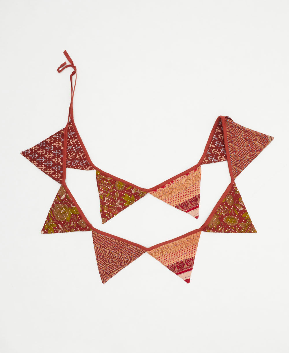 reusable fabric pennant flag in a brick red and green floral print