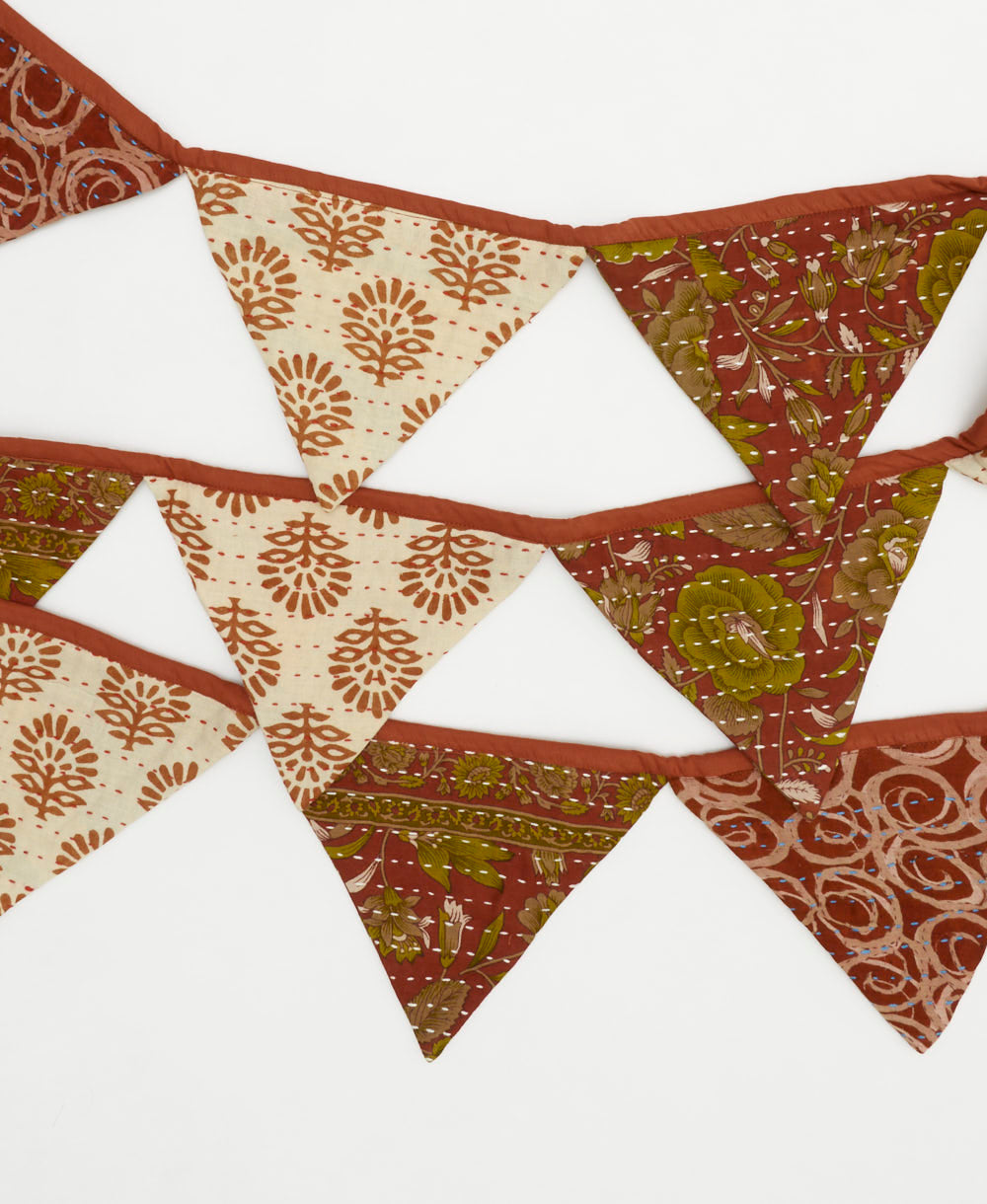 sustainable reusable party garland in brick red and ivory abstract print