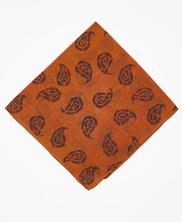 vintage silk scarf featuring a black and orange stamp print created using sustainably sourced saris