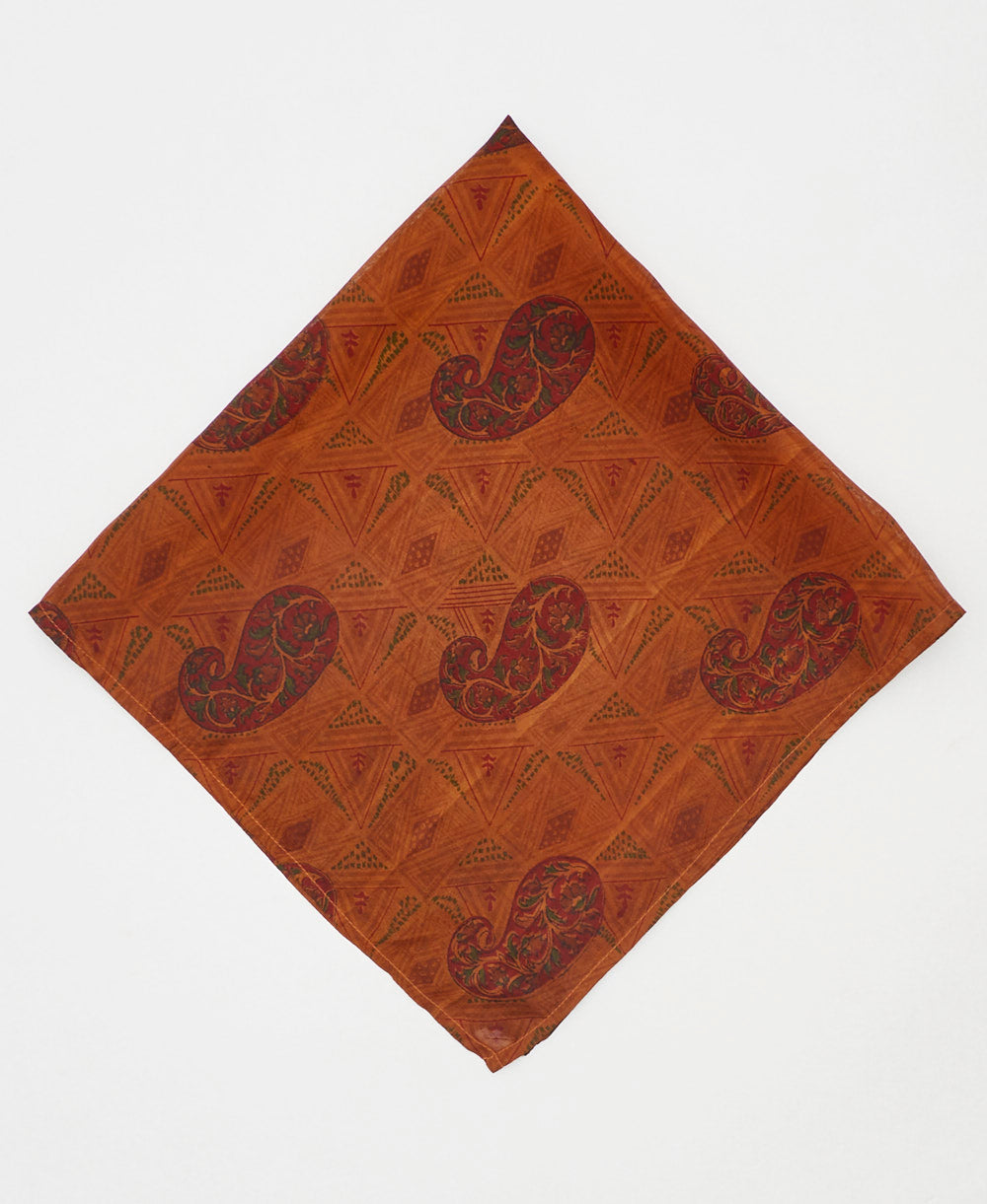 vintage silk scarf featuring a rust orange paisley pattern created using sustainably sourced saris