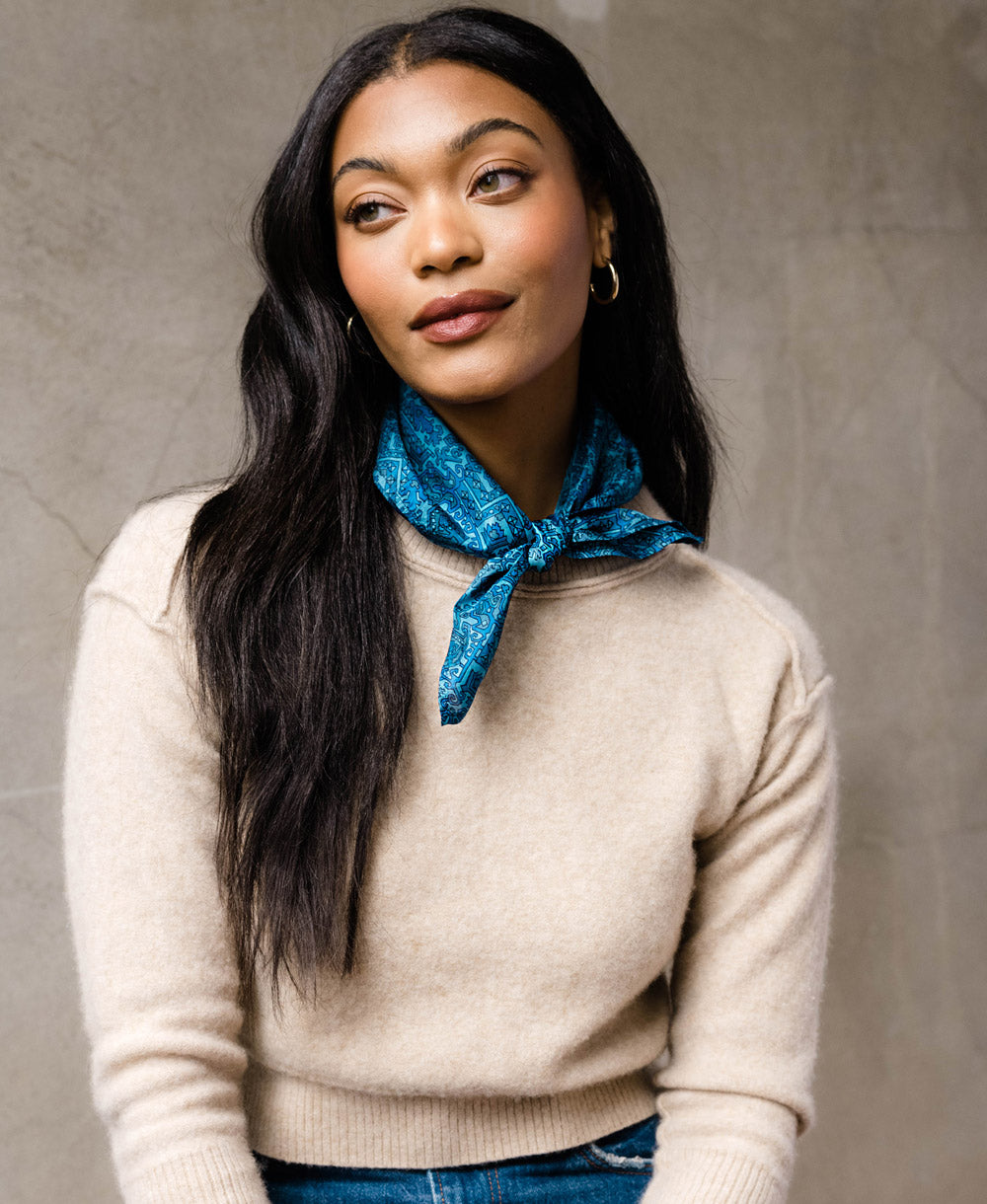 woman wearing a blue vintage silk scarf around her neck made from repurposed silk saris