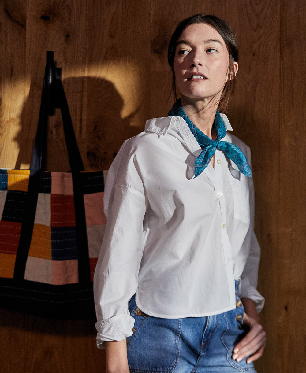 woman wearing a blue vintage silk scarf in her hair  made from repurposed silk saris
