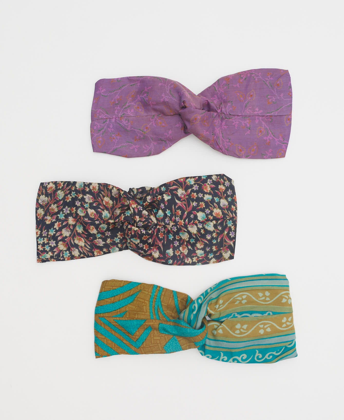 variety of silk twist headbands in blue and purple colorways to show variety