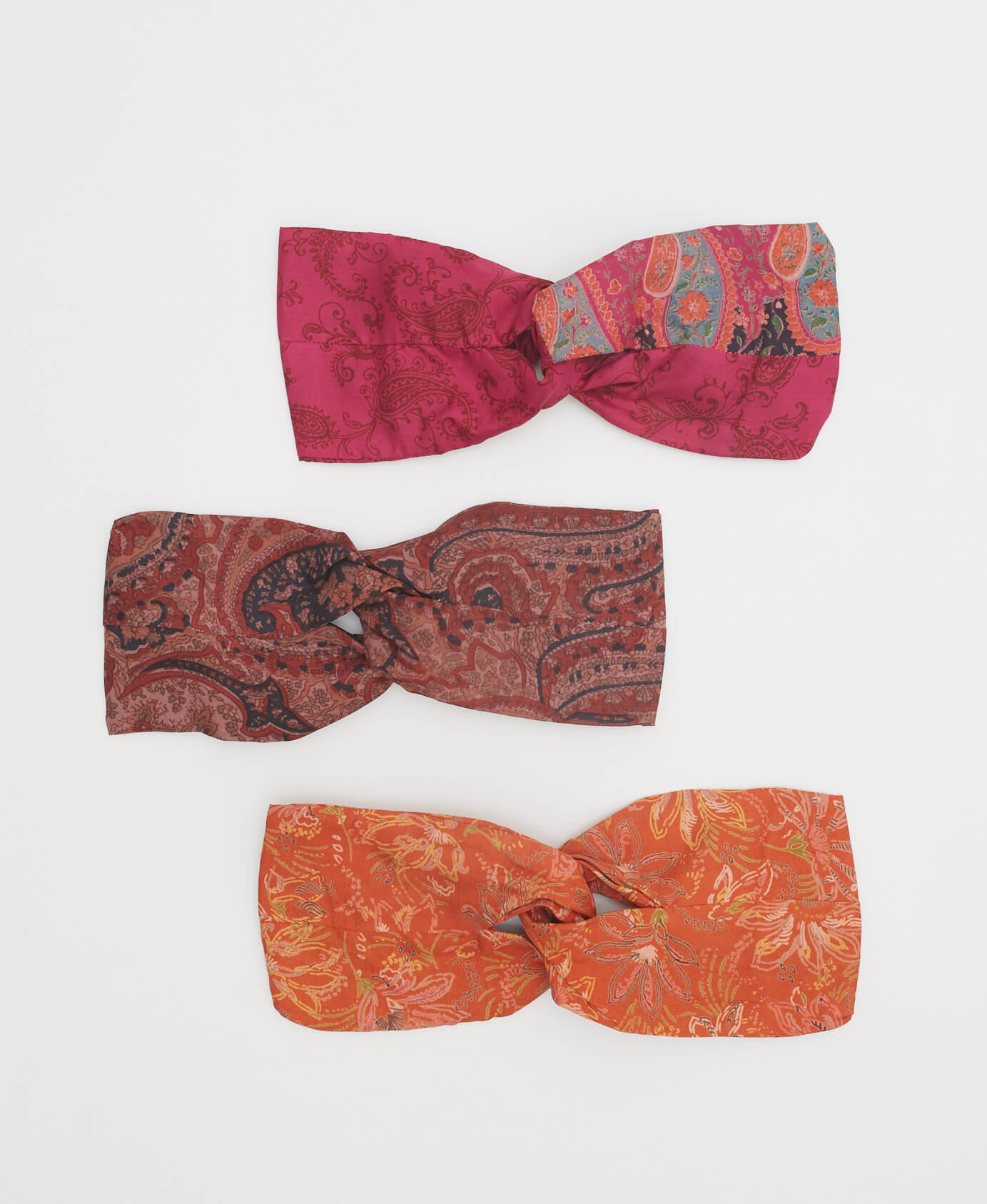 sustainable silk twist headbands in orange, pink and red colorways