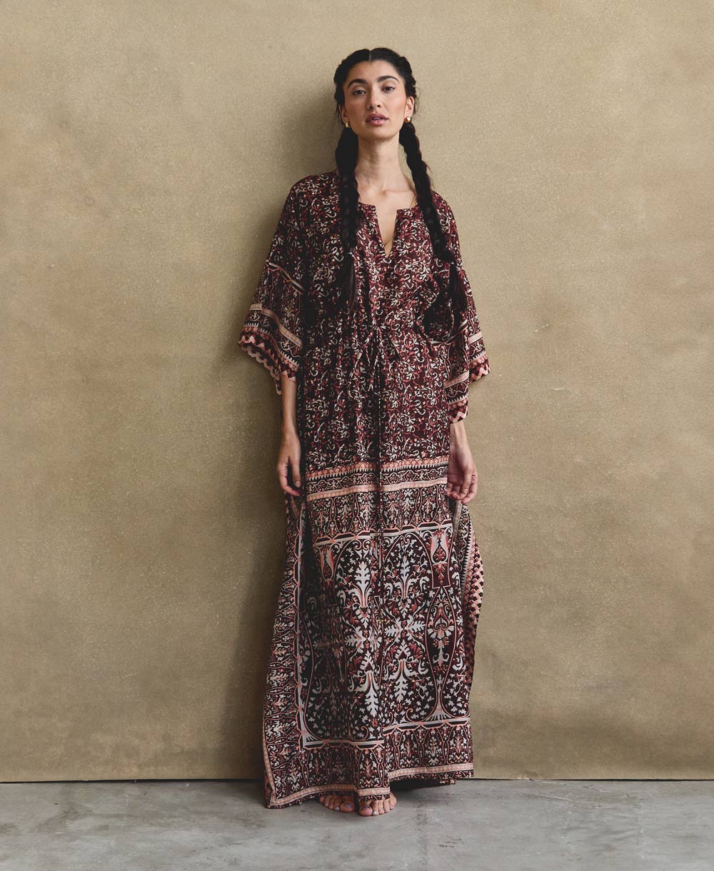 Woman wearing ethically made floral silk kaftan dress made from sourced vintage silk saris in India