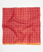 Vibrant red silk square scarf featuring an orange accent around the edge