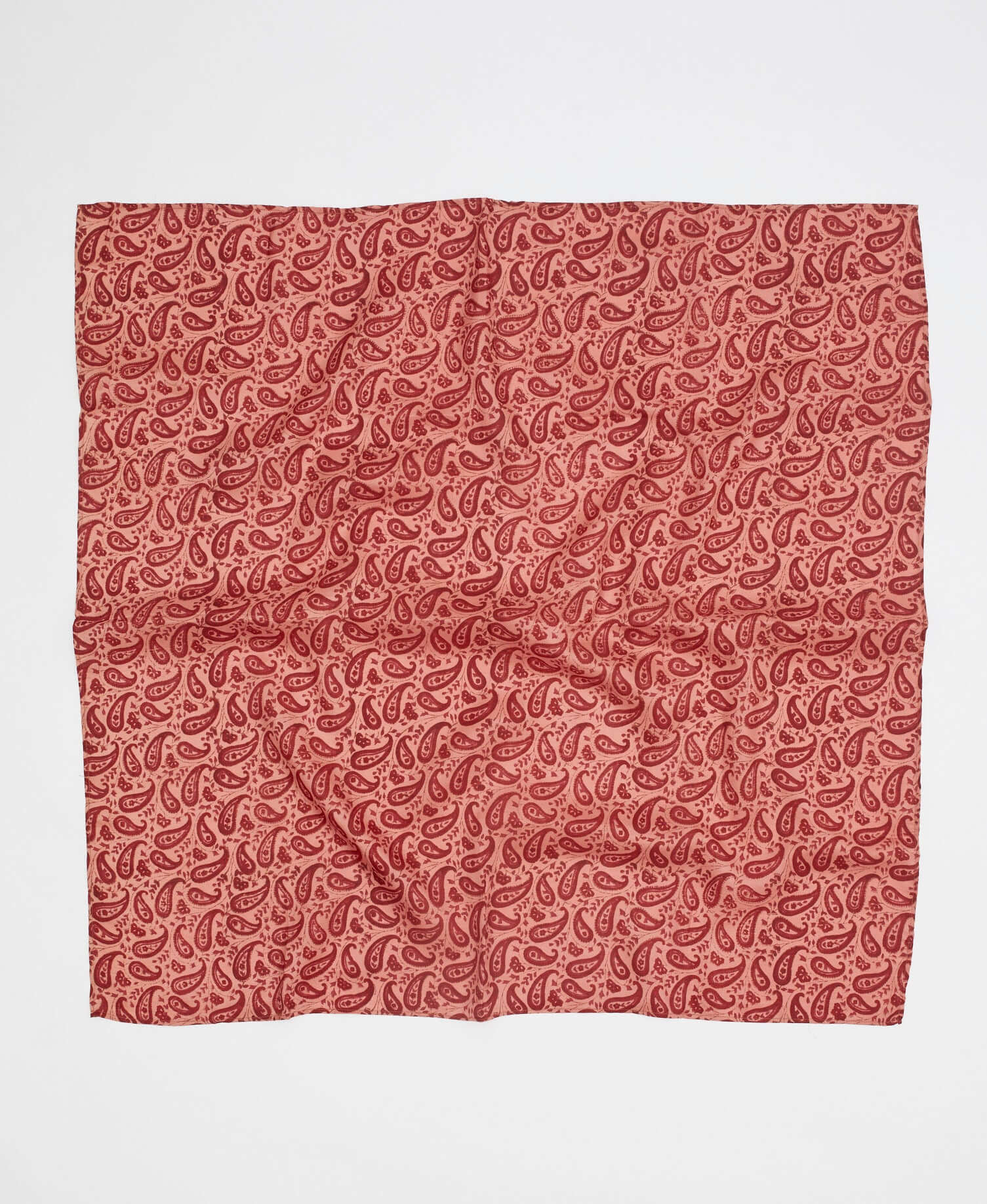 peachy pink silk square scarf made from upcycled saris with a red paisley print