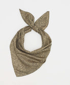 Beige silk square scarf featuring an intricate black paisley pattern