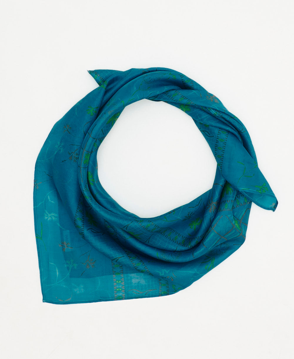 vintage silk square scarf featuring a bright blue and green floral pattern created using sustainably sourced saris