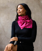 woman wearing artisan-made pink vintage silk square square scarf around her neck 