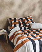 modern camel, black and white interlacing woven patchwork bedding with matching plaid euro shams