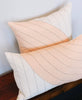 matching set of Fair Trade throw pillows in pink geometric design