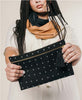 modern sustainable canvas clutch with cross-stitch design
