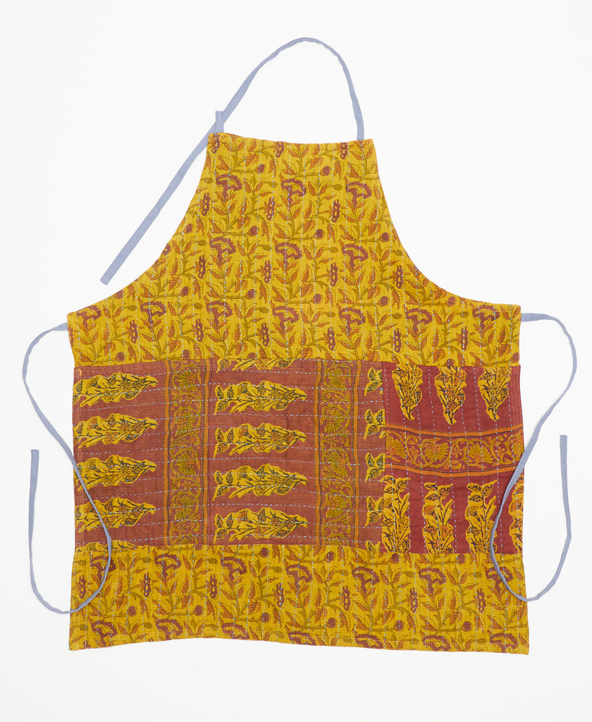 handmade cotton apron made of yellow vintage saris with brown and green flower details and a large patch pocket