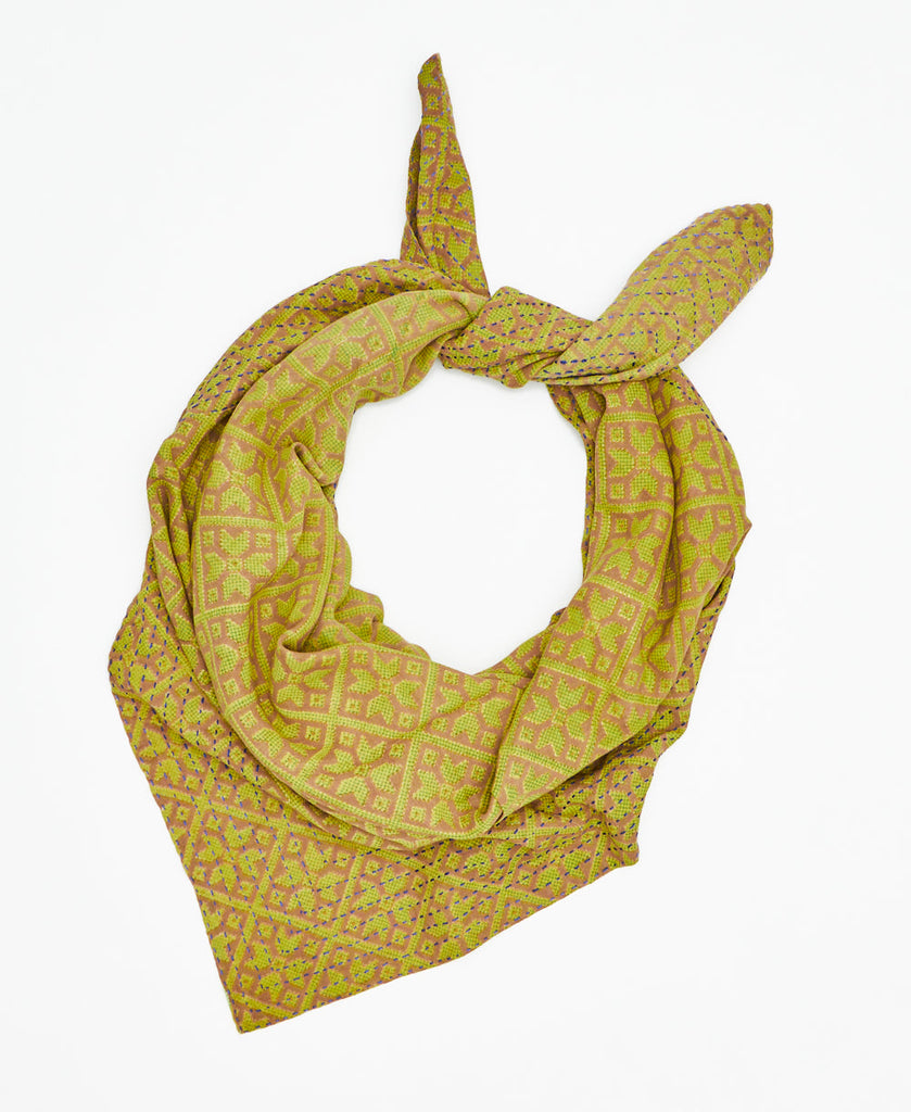 beige cotton square scarf with lime green geometric patterning and blue traditional kantha stitching along the edges