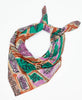 teal, beige, red, and purple geometric cotton square scarf with white traditional kantha stitching along the edges