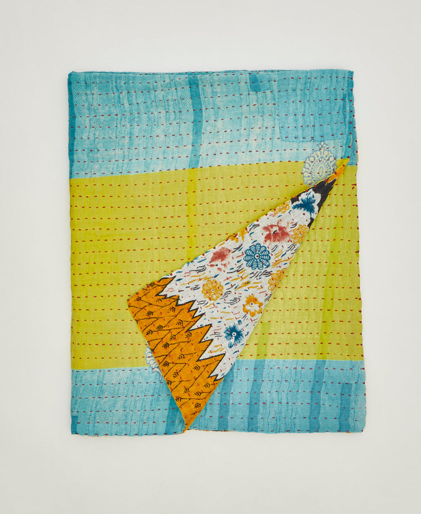 Sustainable small quilt throw created using repurposed vintage cotton saris 