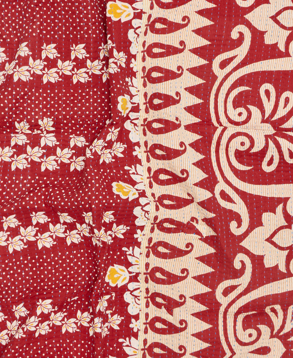 Contrasting cream and red floral and paisley prints make this a unique one-of-a-kind throw quilt 