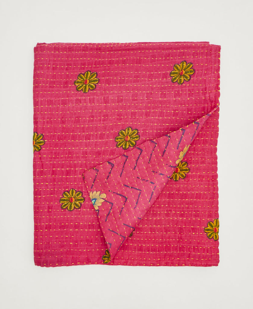 Hot pink with yellow flowers sustainably crafted throw quilt made using repurposed vintage cotton saris 