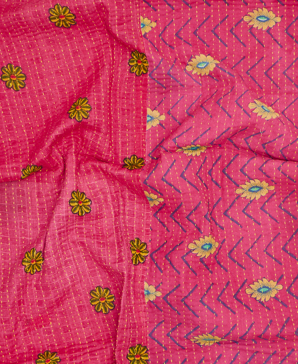 Contrasting pink and yellow floral patterns make this small throw quilt a unique one-of-a-kind piece