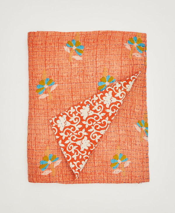 Bright orange floral small throw quilt sustainably crafted using repurposed vintage cotton saris 