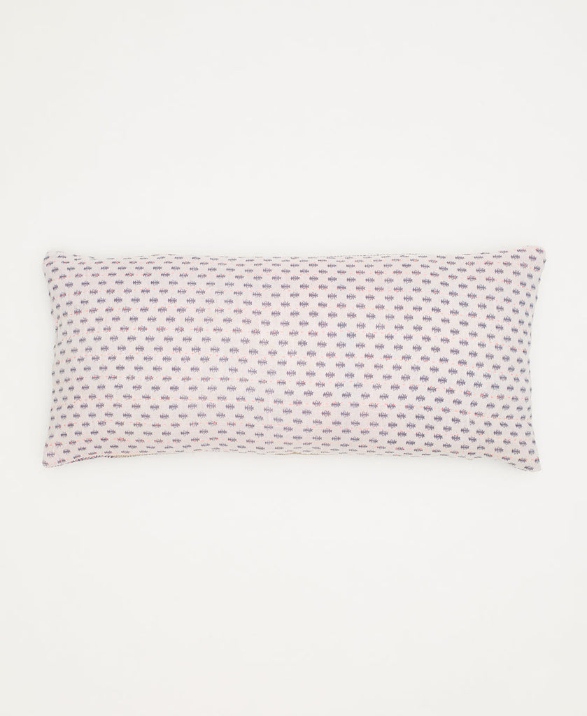 white cotton lumbar pillow with small purple branches and kantha stitching 