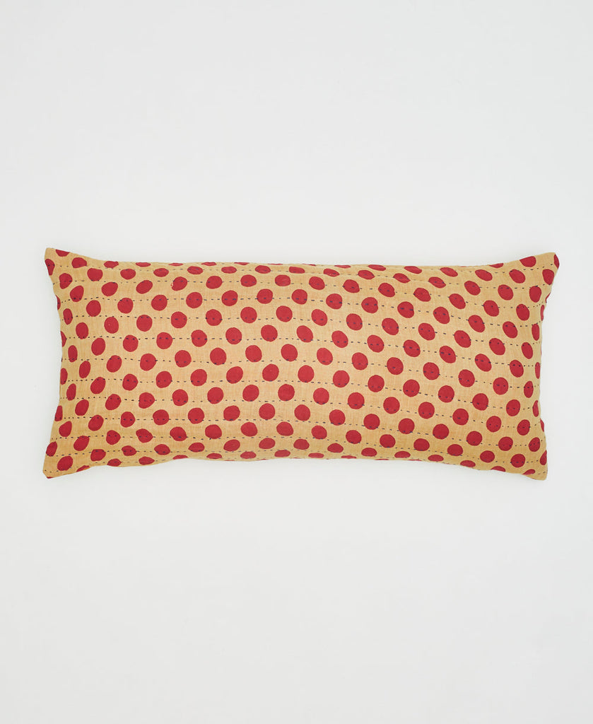 beige cotton lumbar pillow with red polka dots and kantha stitching 