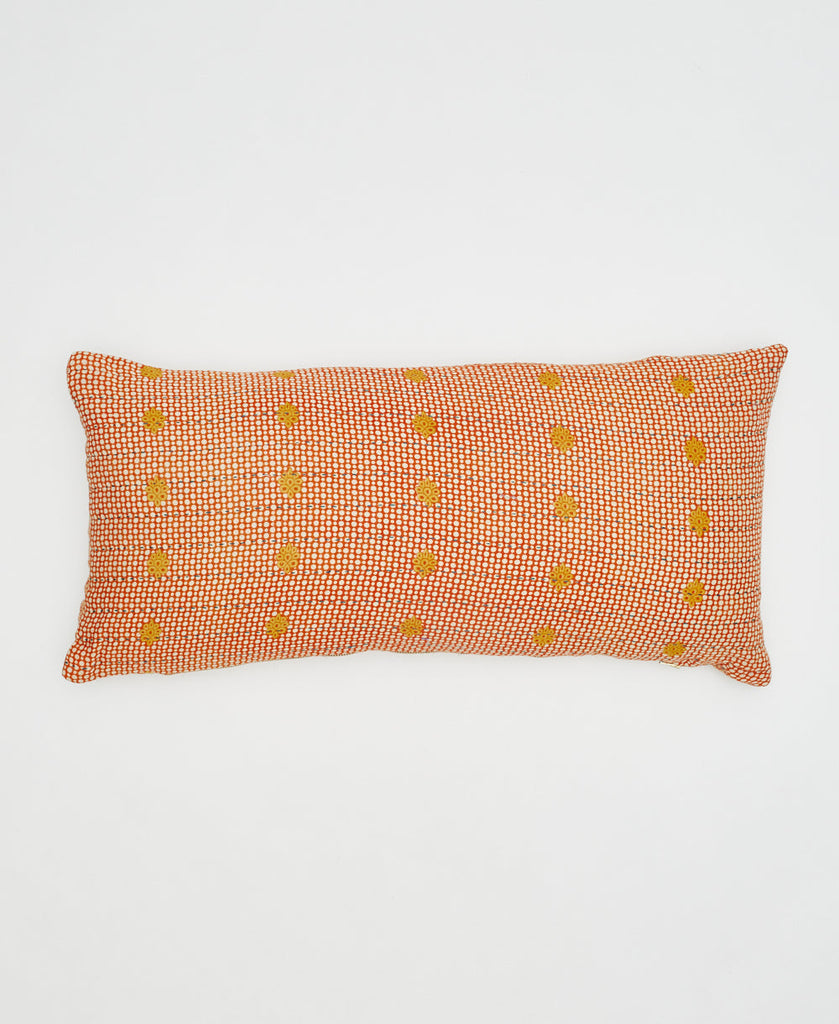orange sustainable cotton lumbar pillow with yellow flowers