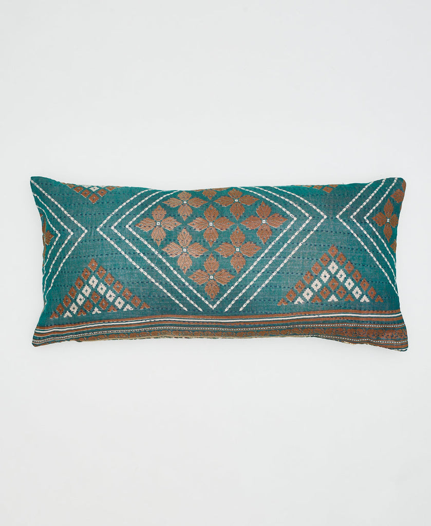 teal sustainable cotton lumbar pillow wiht brown flowers and white geometric details 