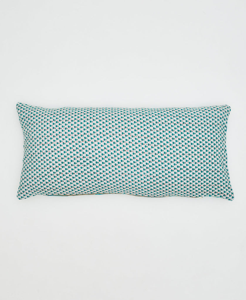white sustainable cotton lumbar pillow with small teal flowers and kantha stitching 