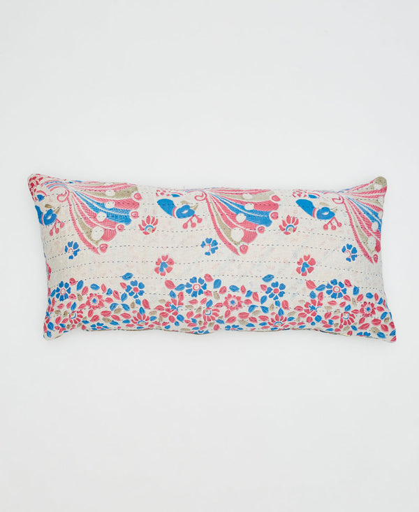 white sustainable cotton lumbar pillow with pink, blue, and beige peacocks and flowers 