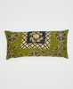 green cotton lumbar pillow with beige and black floral details 