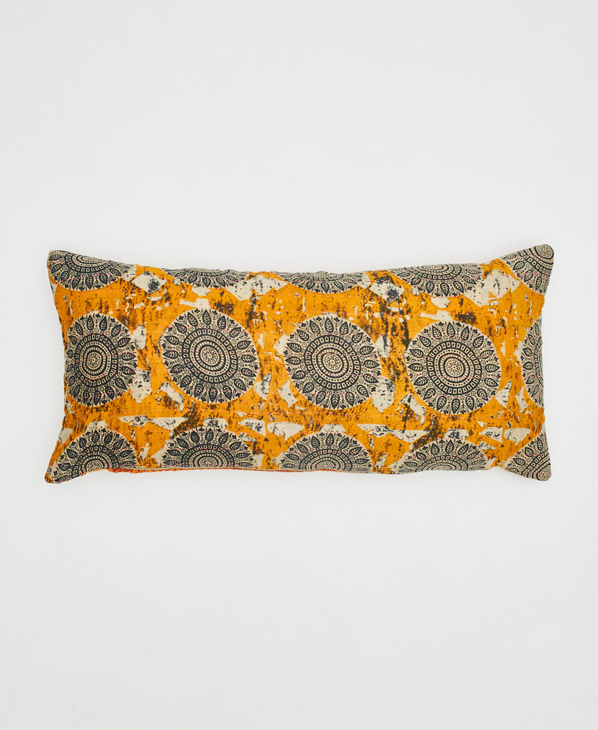 orange cotton lumbar pillow with black and white medallions and kantha stitching 