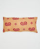 beige cotton lumbar pillow with orange squares and red paisleys 