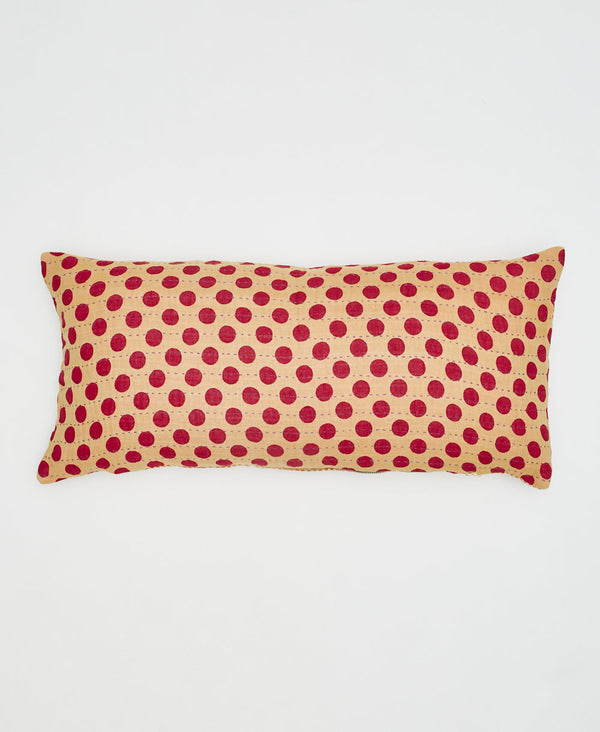 beige sustainable lumbar pillow with red polka dots 