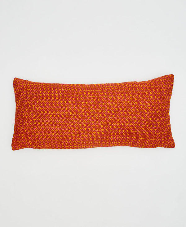 orange, yellow, and pink geometric patterned lumbar pillow