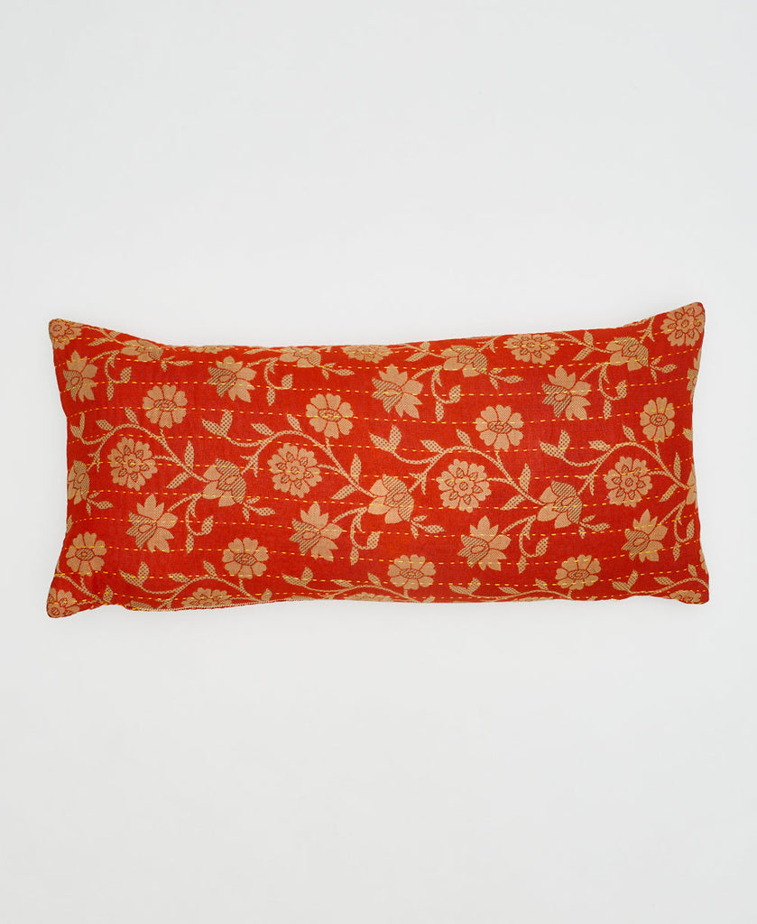 orange eco-friendly lumbar pillow with beige flowers and yellow kantha stitching 