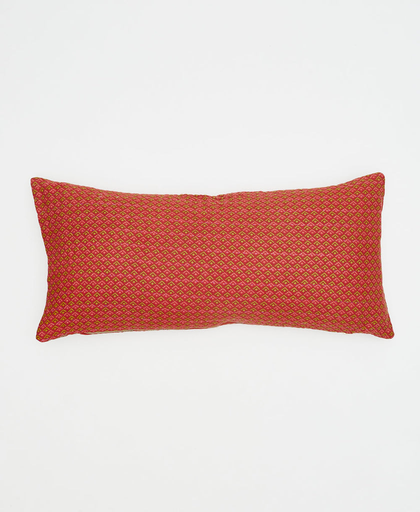 red cotton lumbar pillow with small green geometric details and pink kantha stitching 