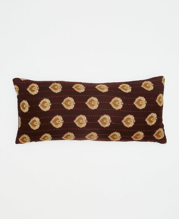 brown eco-friendly lumbar pillow with beige and orange feathers 