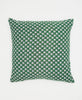 green sustainable throw pillow with small white and black leaves