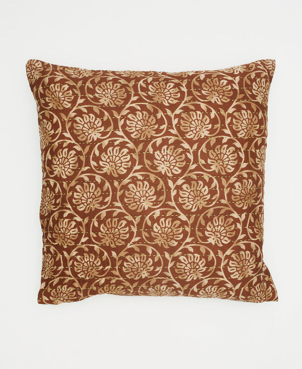 brown sustainable cotton throw pillow with tan swirling vines