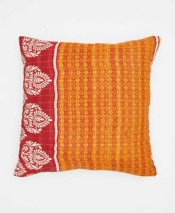 orange cotton throw pillow with a red stripe and white paisleys