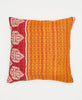 orange cotton throw pillow with a red stripe and white paisleys