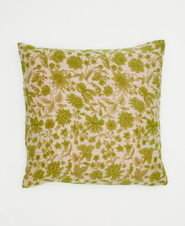 white sustainable throw pillow with green flowers and vines