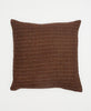 brown cotton throw pillow with a small yellow grid pattern and white kantha stitching 
