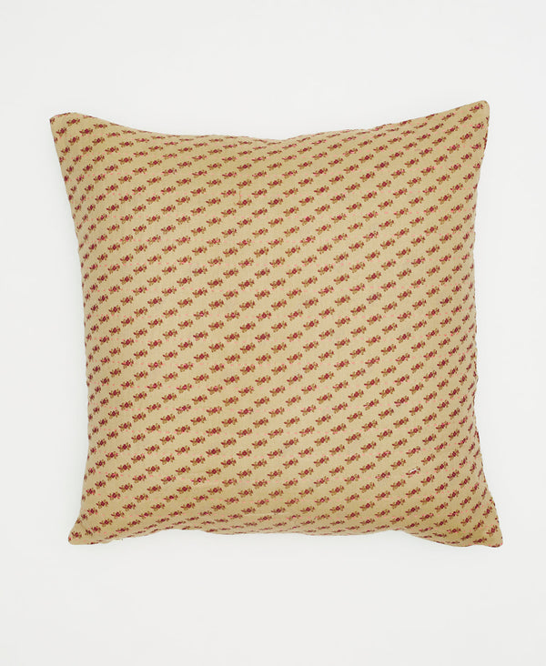 beige cotton throw pillow with small red branches